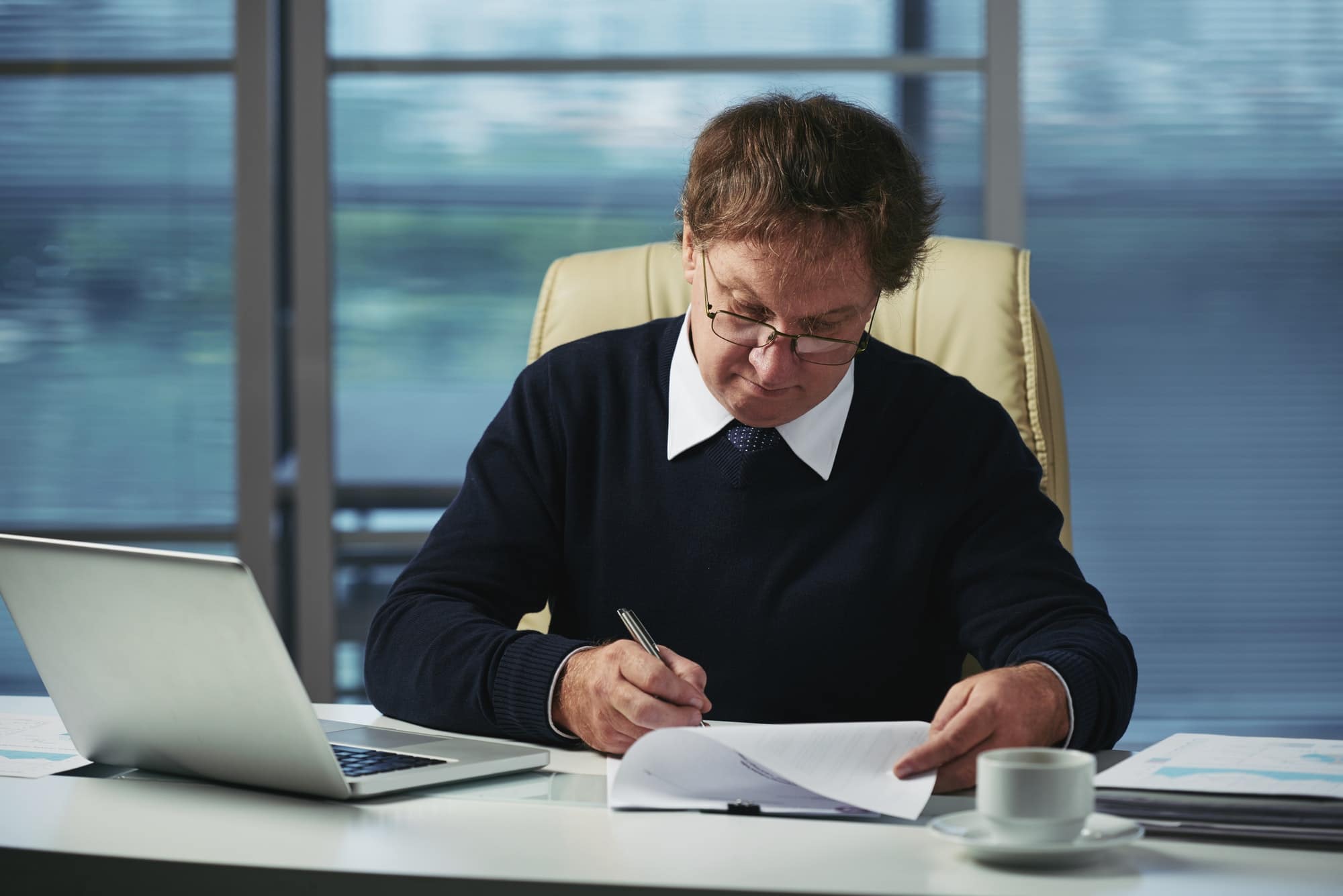 Man at desk working on paperwork